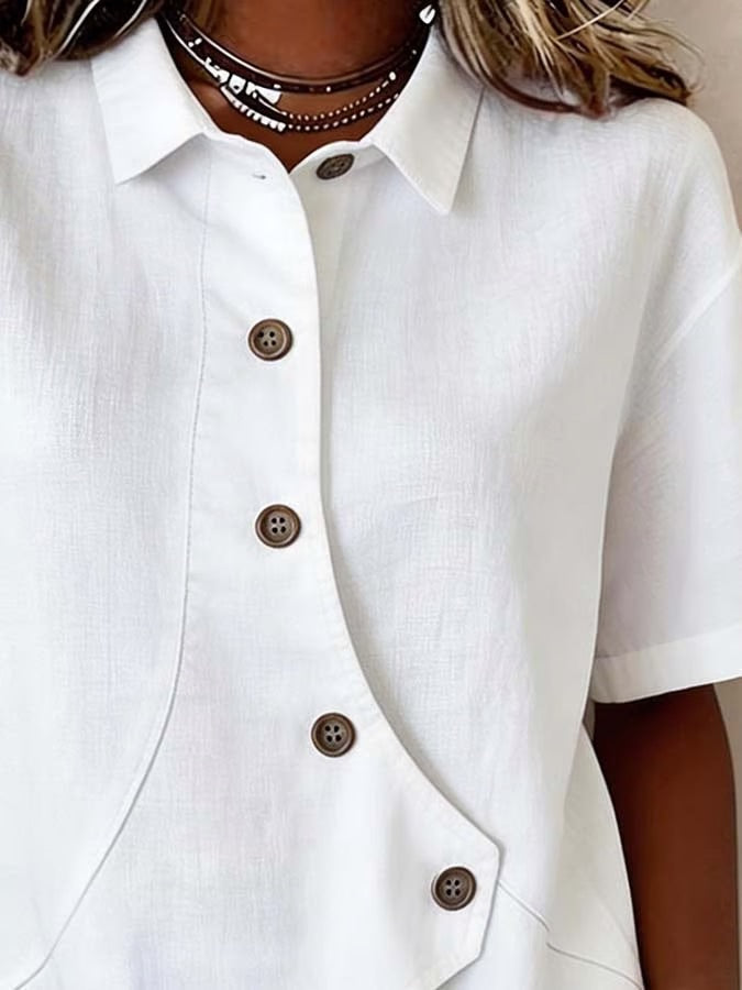 Céline | Blouse chic à boutons à effet statement